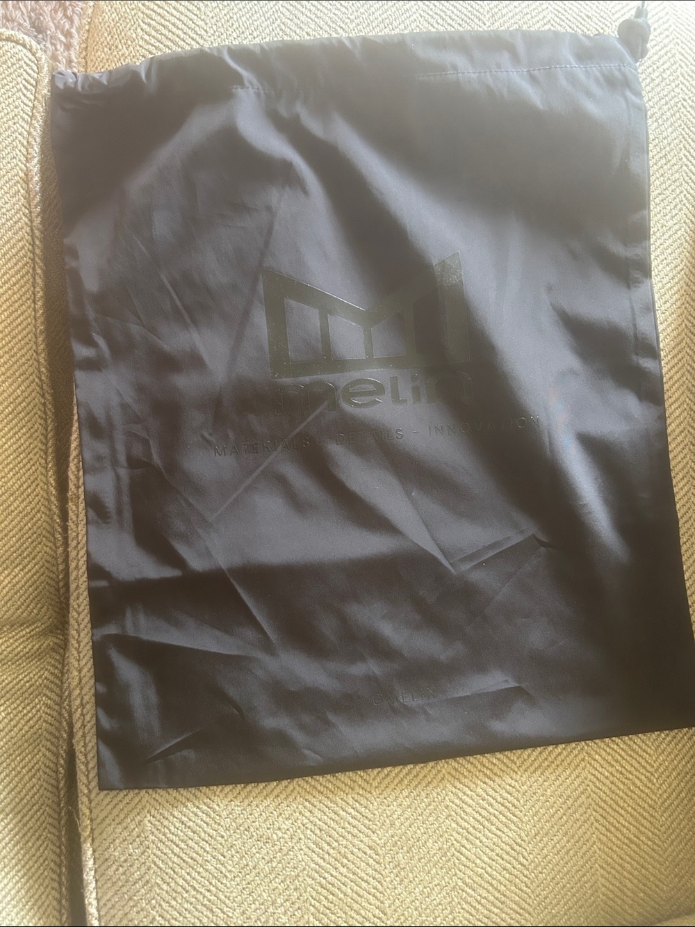 Melin Black Drawstring Hat Bag